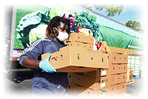 Man carrying pallet of food