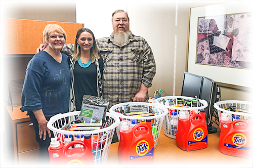 Team Ascentra makes a donation to the Muskie Locker